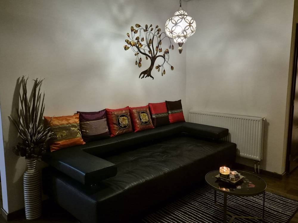 Waiting area with a sofa and Thai cushions